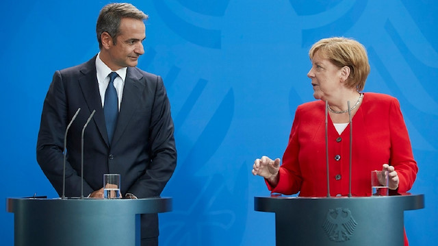 Almanya Başbakanı Merkel ile Yunanistan Başbakanı Miçotakis.