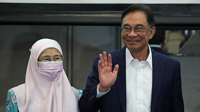 Malaysia opposition leader Anwar Ibrahim and his wife Wan Azizah Wan Ismail react after a news conference in Kuala Lumpur, Malaysia September 23, 2020