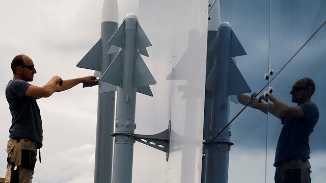 FILE PHOTO: A worker installs two Rafael Air Missile Defence models, before the opening of the 53rd Paris Air Show at Le Bourget Airport near Paris, France June 14 2019. REUTERS/Pascal Rossignol/File Photo

