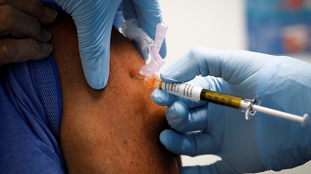 A volunteer is injected with a vaccine as he participates in a coronavirus disease (COVID-19) vaccination study at the Research Centers of America, in Hollywood, Florida, U.S., September 24, 2020. REUTERS/Marco Bello

