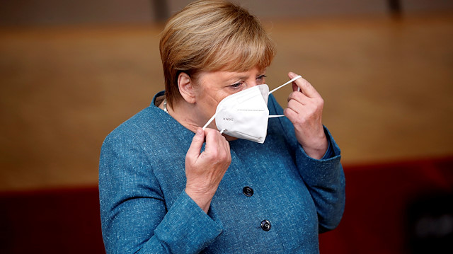 German Chancellor Angela Merkel adjusts her protective mask as she arrives for the second face-to-face European Union summit since the coronavirus disease (COVID-19) outbreak, in Brussels, Belgium October 1, 2020. Francisco Seco/Pool via REUTERS

