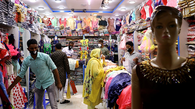 Customers are seen inside a clothing shop as limited number of shopping malls reopened after the government has eased the restrictions amid concerns over the coronavirus disease (COVID-19) outbreak in Dhaka, Bangladesh May 11, 2020. REUTERS/Mohammad Ponir Hossain

