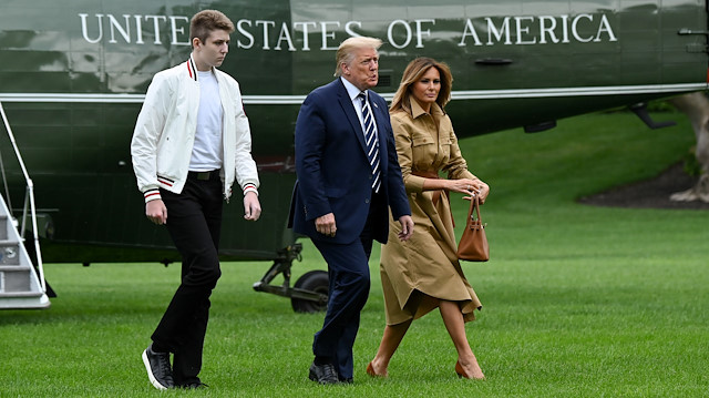 U.S. President Donald Trump, First Lady Melania Trump and their son Barron walk to the White House from Marine One in Washington, U.S. August 16, 2020.