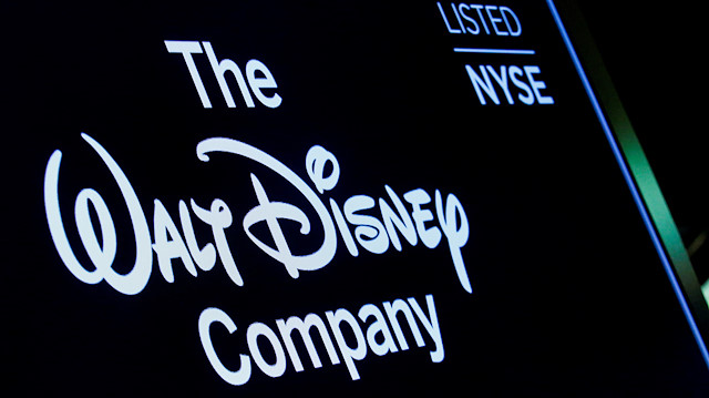 A screen shows the logo and a ticker symbol for The Walt Disney Company on the floor of the New York Stock Exchange (NYSE) in New York, U.S., December 14, 2017.