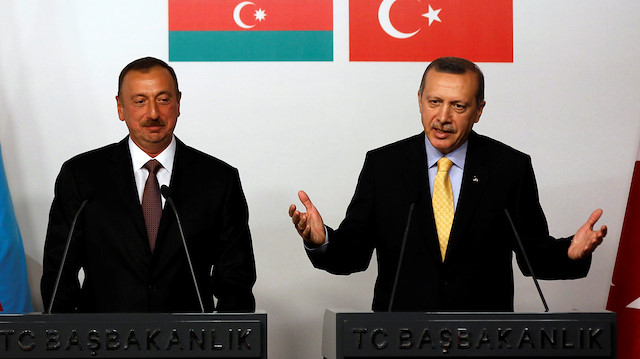 FILE PHOTO: Turkey's Prime Minister Tayyip Erdogan (R) speaks as Azerbaijan's President Ilham Aliyev listens during a news conference following a signing ceremony in Istanbul June 26, 2012. REUTERS/Murad Sezer/File Photo


