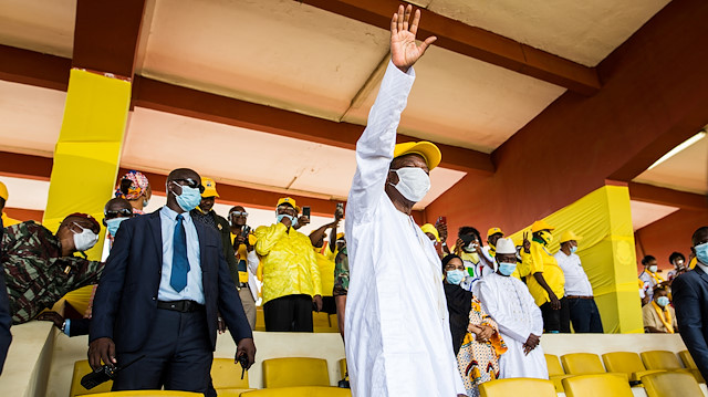 Guinea's outgoing president and presidential candidate Alpha Conde, leader of Rally for the People of Guinea (RPG) waves to supporters as he attends his closing campaign rally ahead of the presidential election in Conakre, Guinea October 16, 2020.