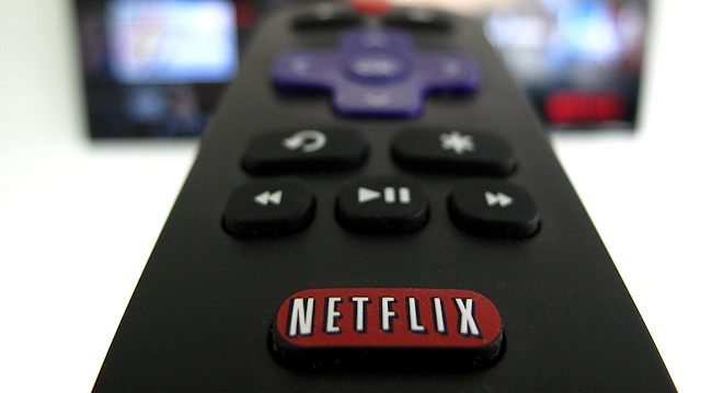 The Netflix logo is pictured on a television remote in this illustration photograph