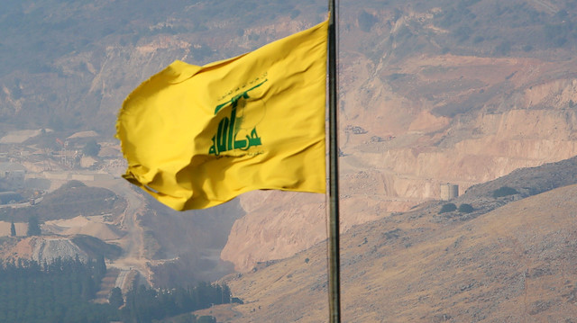A Hezbollah flag flutters in the southern Lebanese village of Khiam