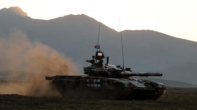 Azerbaijani soldiers maneuver with a tank 