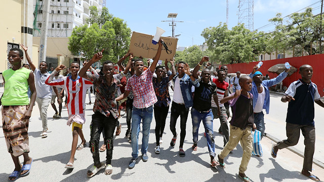 Somalis chant anti-France slogans during a protest against the publications of a cartoon of Prophet Mohammad in France and French President Emmanuel Macron's comments, along the streets of Mogadishu, Somalia October 28, 2020