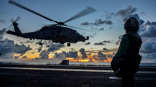 FILE PHOTO: An MH-60R Sea Hawk helicopter launches during flight operations aboard the U.S. Navy aircraft carrier USS Ronald Reagan in the South China Sea July 17, 2020. Picture taken July 17, 2020. U.S. Navy/Mass Communication Specialist 2nd Class Codie L. Soule/Handout via REUTERS. THIS IMAGE HAS BEEN SUPPLIED BY A THIRD PARTY./File Photo


