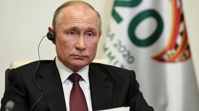 Russian President Vladimir Putin takes part in a video conference 