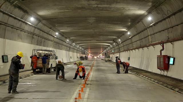 Labourers work inside the newly constructed Atal Tunnel on the Leh-Manali highwa