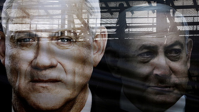 A banner depicts Benny Gantz, leader of Blue and White party, and Israel Prime minister Benjamin Netanyahu, as part of Blue and White party's campaign ahead of the upcoming election, in Tel Aviv, Israel February 17, 2020.