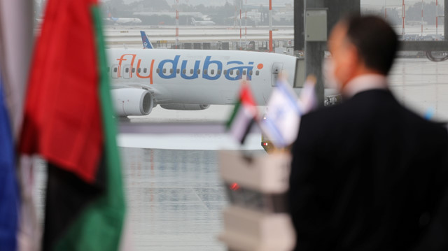 A part of a United Arab Emirates airline flydubai airliner is seen through a glass panel during a welcoming ceremony attending by Israeli Prime Minister Benjamin Netanyahu upon its landing at Ben Gurion International Airport, near Tel Aviv, Israel November 26, 2020