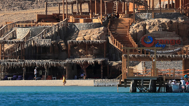 Tourists are seen during a summer vacation on the Orange beach at a Red Sea resort