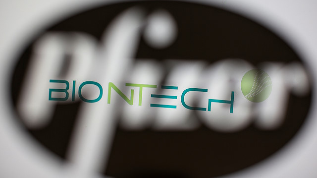  Biontech's logo is seen through a 3D-printed Pfizer logo in this illustration