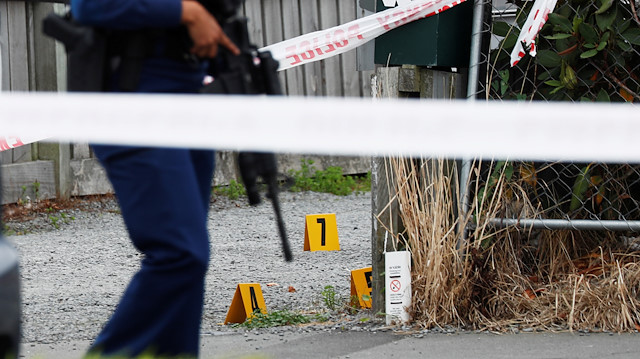 Police guard the site of Friday's shooting undergoing investigation, outside the Linwood Mosque, in Christchurch, New Zealand 

