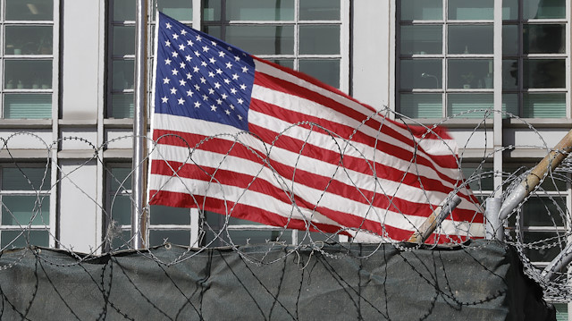  A flag flies behind an enclosure on the territory of the U.S. embassy in Moscow