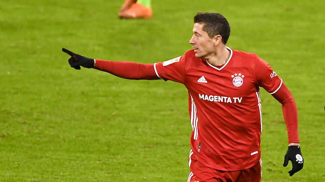 Soccer Football - Bundesliga - Bayern Munich v VfL Wolfsburg - Allianz Arena, Munich, Germany - December 16, 2020 Bayern Munich's Robert Lewandowski celebrates scoring their first goal Pool via REUTERS