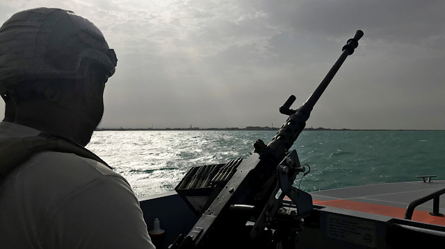 UAE navy soldier patrols at Al-Mokha port in Yemen