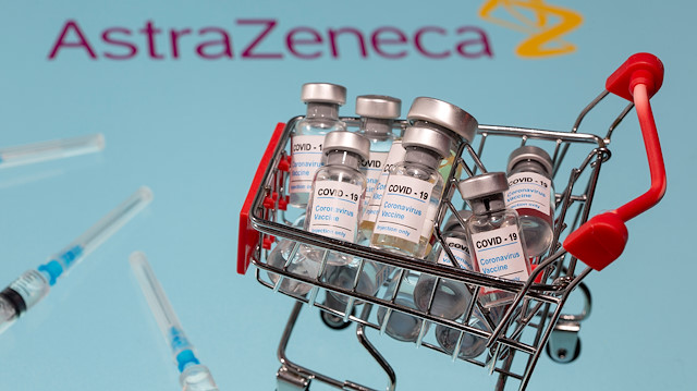 FILE PHOTO: A small shopping basket filled with vials labeled "COVID-19 - Coronavirus Vaccine" and medical syringes are placed on an AstraZeneca logo in this illustration taken November 29, 2020. REUTERS/Dado Ruvic/Ilustration/File Photo

