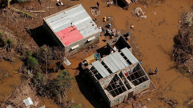 Flooded buildings are seen as waters begin to recede in the aftermath of Cyclone Idai, in Buzi near Beira, Mozambique, March 24, 2019. 