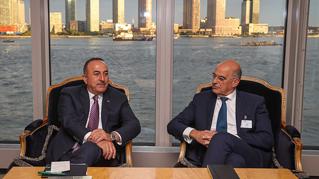 Turkish Foreign Minister Mevlut Cavusoglu and his Greek counterpart Nikos Dendias