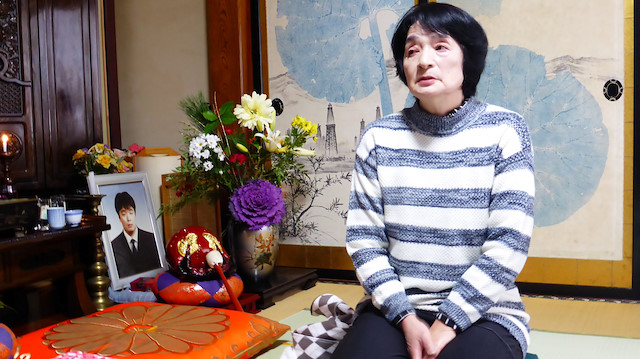 Taeko Watanabe, whose son Yuki who committed suicide in 2008, talks in front of his portrait at her home in Akita, Japan February 9, 2019. Picture taken February 9, 2019. REUTERS/Elaine Lies

