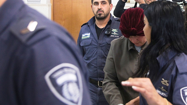 Malka Leifer, a former Australian school principal who is wanted in Australia on suspicion of sexually abusing students, walks in the corridor of the Jerusalem District Court accompanied by Israeli Prison Service guards, in Jerusalem February 14, 2018.