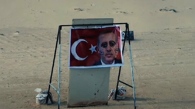 ​Haftar militias use defaced Erdoğan picture, Turkish flag as 'target practice'