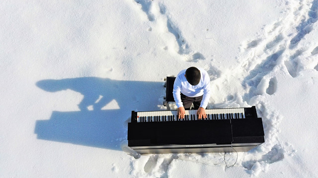 9 year-old pianist perform amid the snow-covered field in Turkey's Mus

