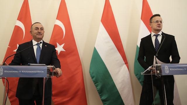 Turkey's Foreign Minister Mevlut Cavusoglu (L) in Budapest


