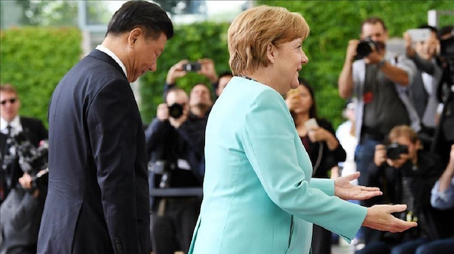 FILE PHOTO - President of People's Republic of China Xi Jinping (L) Chancellor of Germany Angela Merkel (R) in the Chancellery in Berlin, Germany in July 2017. Photo: Maurizio Gambarini - Anadolu Agency