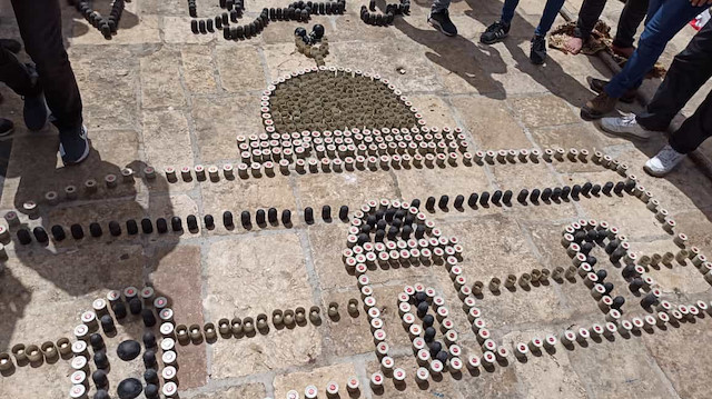 ​Filistinliler mesajlarını İsrail'in attığı mermi kovanlarıyla verdi.