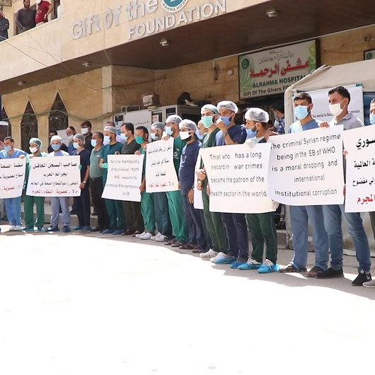 Suriyeli sağlık çalışanları Esad rejiminin DSÖ’nün Yürütme Kuruluna üye seçilmesini protesto etti