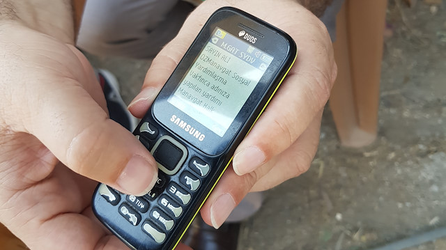 Demirciler Mahallesi'nde evi yanan Ali Öz'ün cep telefonuna gelen mesaj