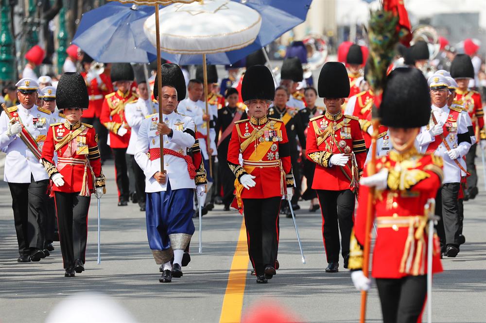 Thailand's King Maha Vajiralongkorn (C) marches during the royal cremation procession of late King Bhumibol Adulyadej at the Grand Palace in Bangkok, Thailand.