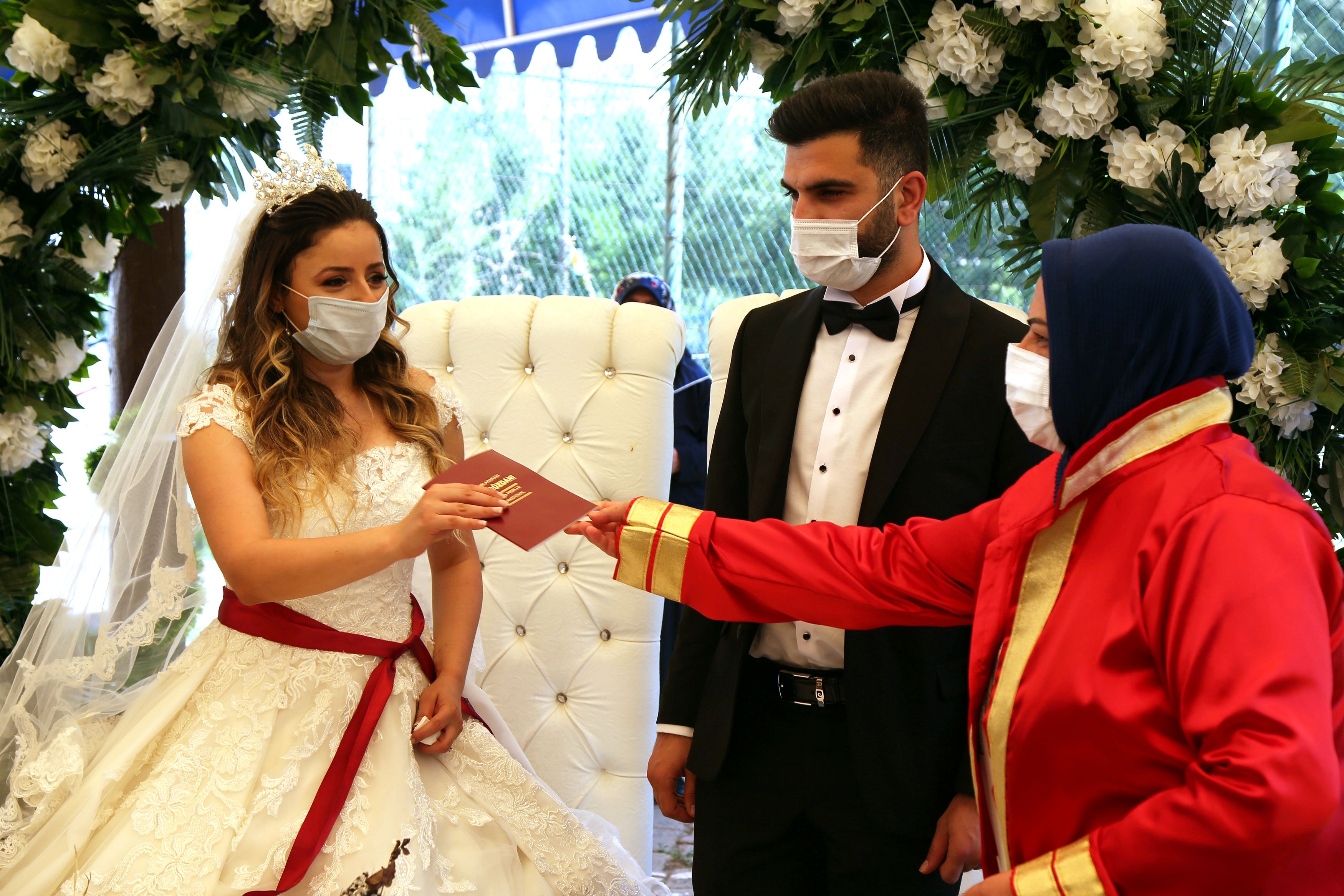 You may not kiss the bride! Turkey's wedding halls reopen- but with a twist