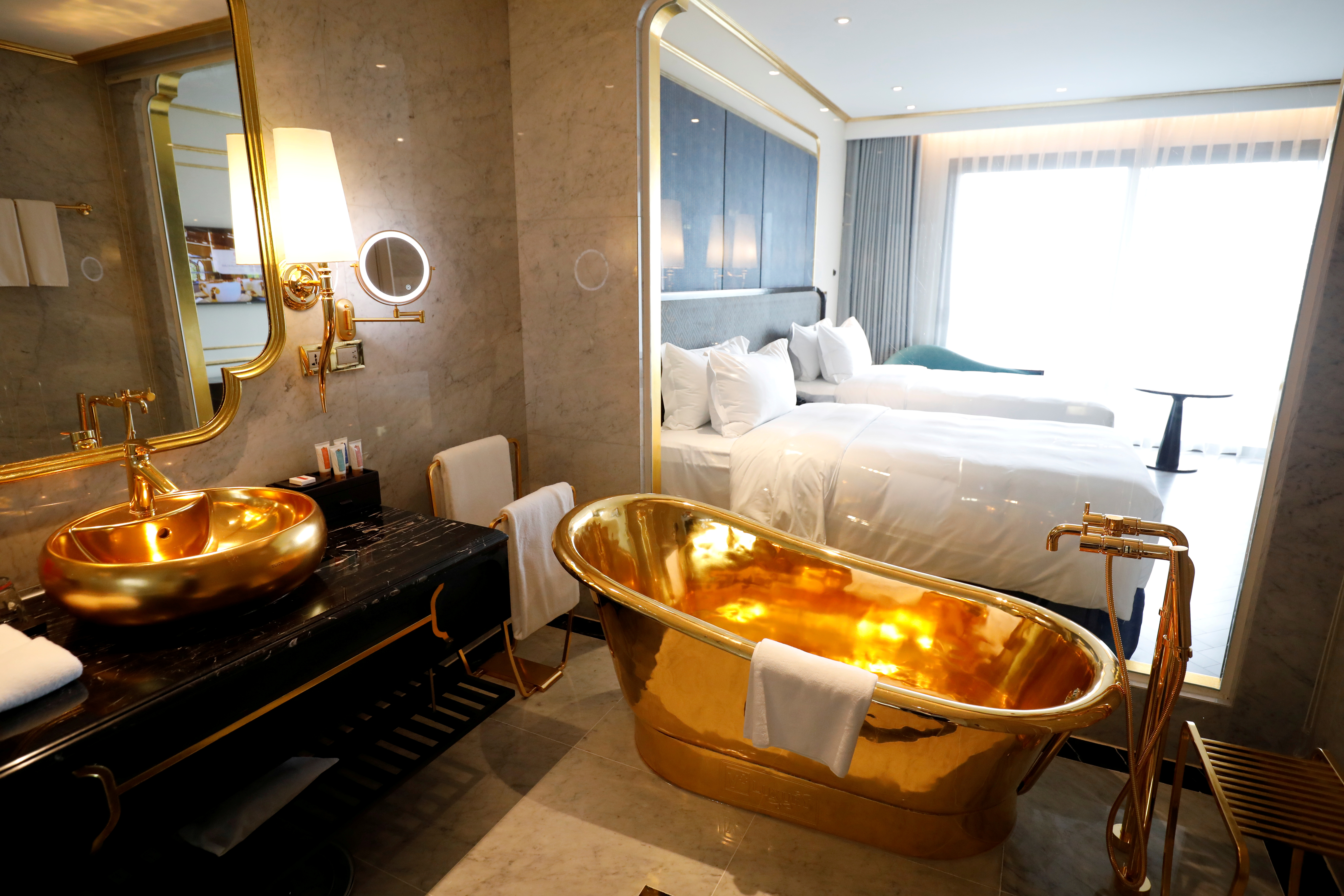 Golden potty and tubs! Vietnam welcomes guests into luxurious gilded hotel