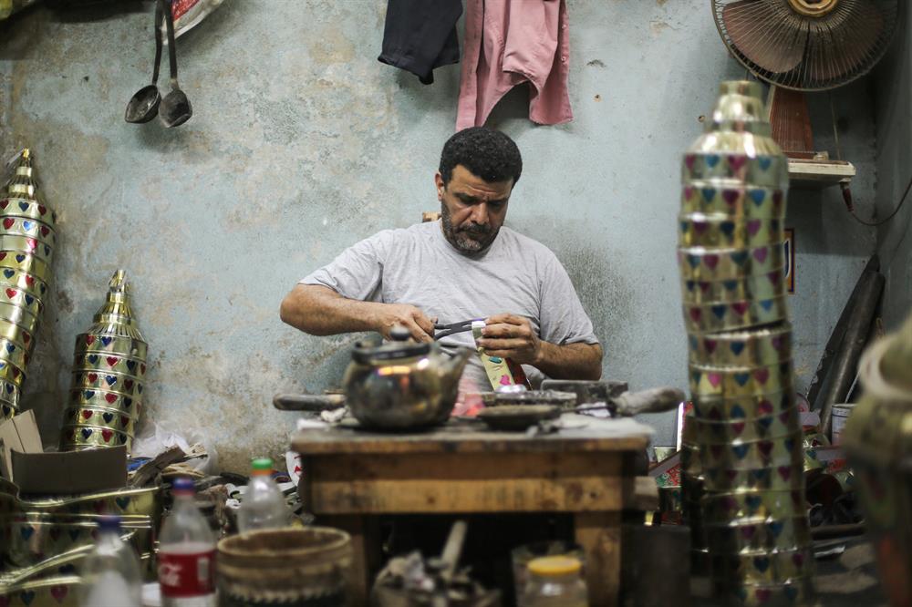 Craftsman Nasir Mohammad makes a Fanous lamp (Ramadan Lantern) at a market ahead of Muslims' Holy Month of Ramadan at Sayyida Zaynab district of Cairo in Egypt on May 17, 2017. The traditional use of fanous as decorations and people hold fanous to celebrate during the holy month of Ramadan.