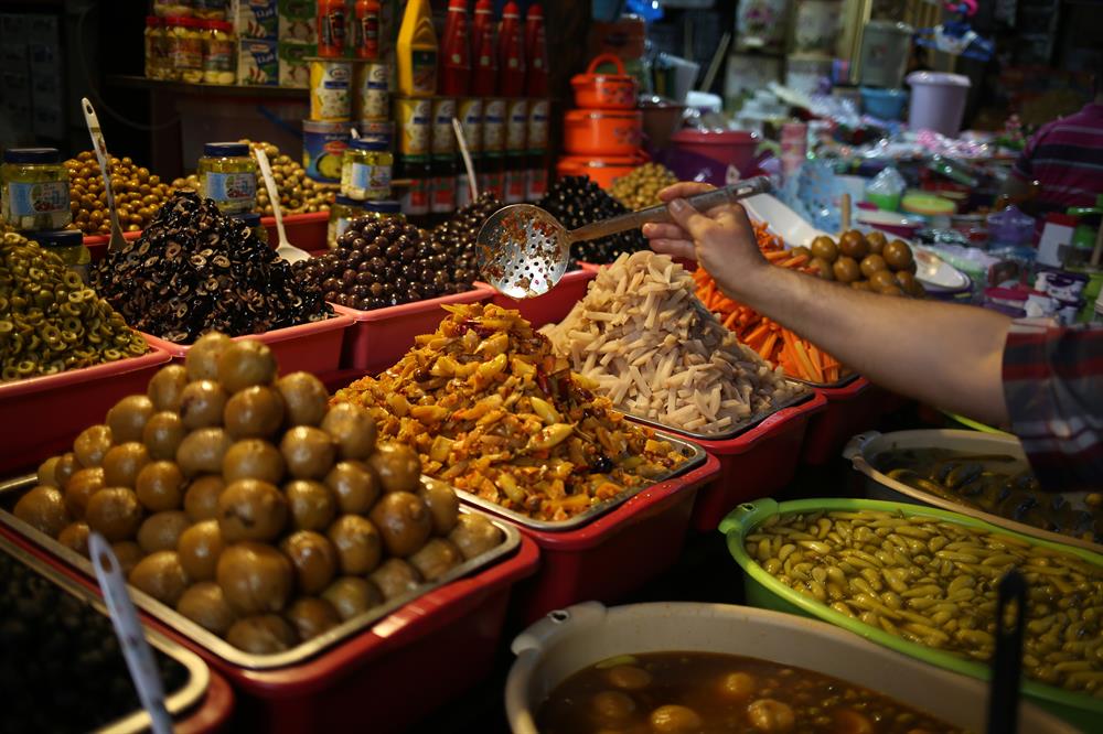 Olives are seen as people shop for the the Islamic holy month of Ramadan in Gaza City, Gaza on May 26, 2017.