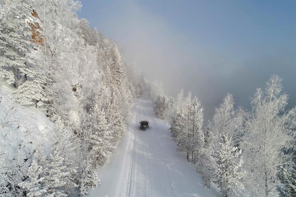 Snowy landscapes on the bank of the Yenisei River in the Siberian Taiga area, with the air temperature at about minus 35 degrees Celsius (minus 31 degrees Fahrenheit), outside Krasnoyarsk, Russia