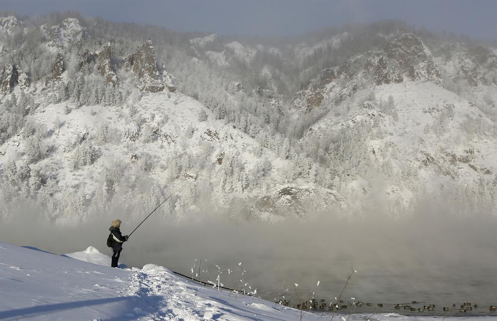 Snowy landscapes on the bank of the Yenisei River in the Siberian Taiga area, with the air temperature at about minus 35 degrees Celsius (minus 31 degrees Fahrenheit), outside Krasnoyarsk, Russia