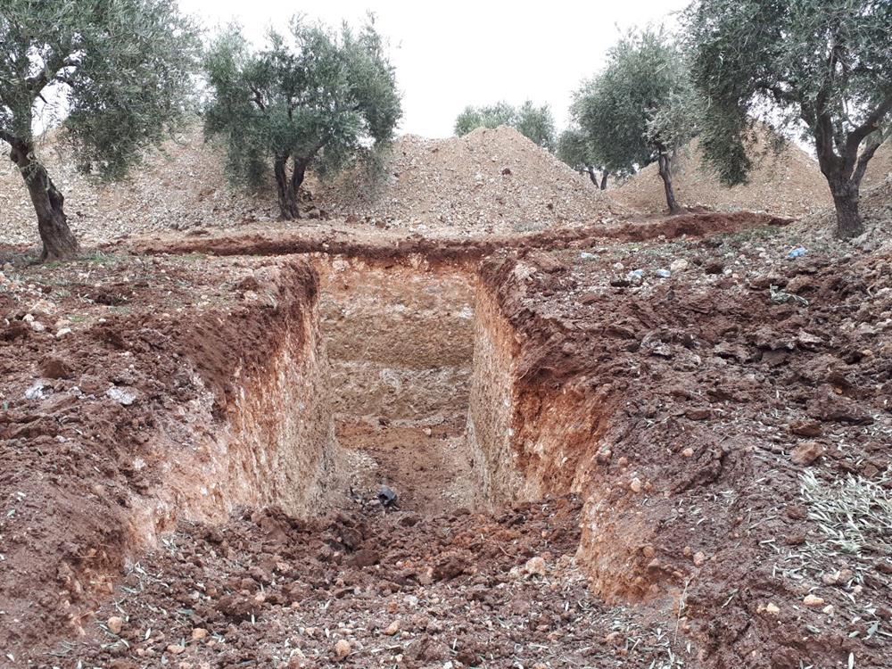 A ditch, which was dug by PYD/PKK terrorists, is seen at the region after Turkish Armed Forces and Free Syrian Army cleared Nisriyye village of Afrin from PYD/PKK terrorists within the "Operation Olive Branch", launched in Syria's Afrin region, on February 9, 2018 in Aleppo's Afrin, Syria. Turkey launched Operation Olive Branch on January 20 in Syria’s northwestern Afrin region; the aim of the operation is to establish security and stability along Turkish borders and the region as well as to eliminate PKK/KCK/PYD-YPG and Daesh terror groups, and protect the Syrian people from the oppression and cruelty of terrorists.