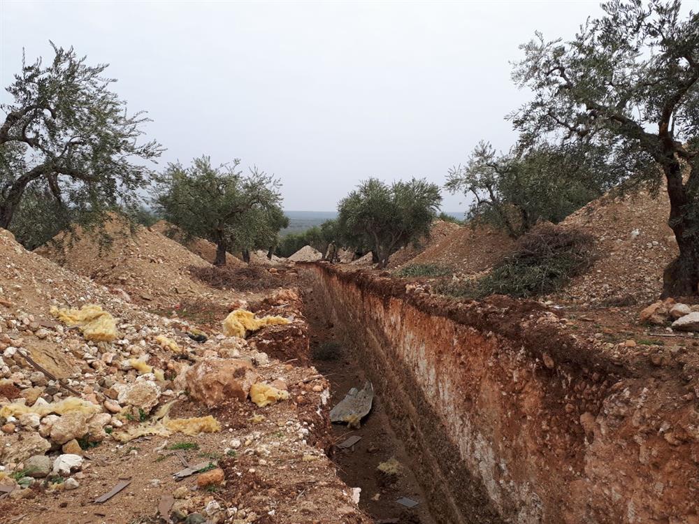 A ditch, which was dug by PYD/PKK terrorists, is seen at the region after Turkish Armed Forces and Free Syrian Army cleared Nisriyye village of Afrin from PYD/PKK terrorists within the "Operation Olive Branch", launched in Syria's Afrin region, on February 9, 2018 in Aleppo's Afrin, Syria. Turkey launched Operation Olive Branch on January 20 in Syria’s northwestern Afrin region; the aim of the operation is to establish security and stability along Turkish borders and the region as well as to eliminate PKK/KCK/PYD-YPG and Daesh terror groups, and protect the Syrian people from the oppression and cruelty of terrorists.