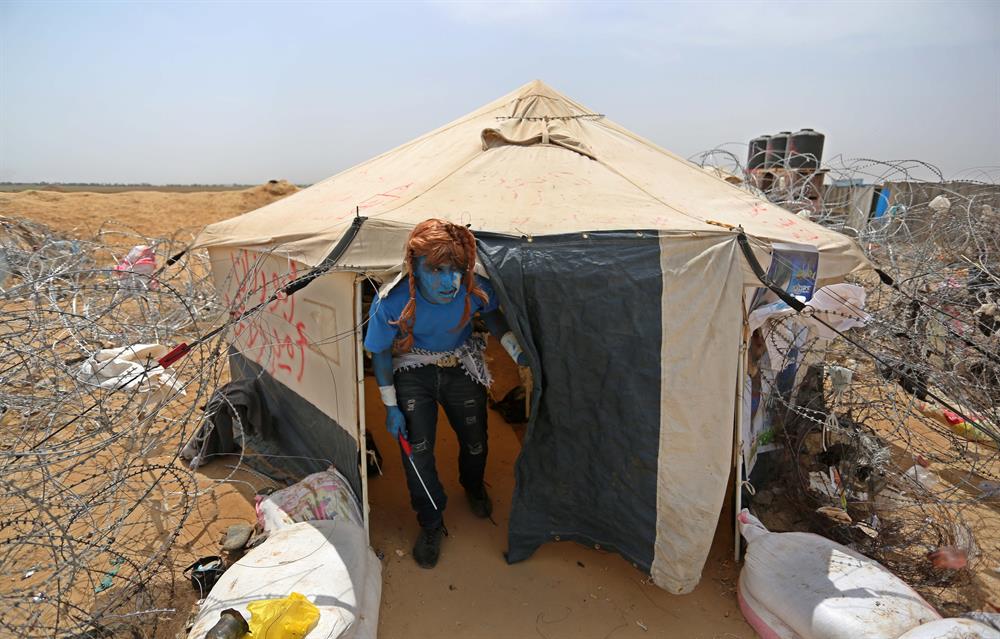 Palestinians dressed as Avatar characters protest near Gaza-Israel border