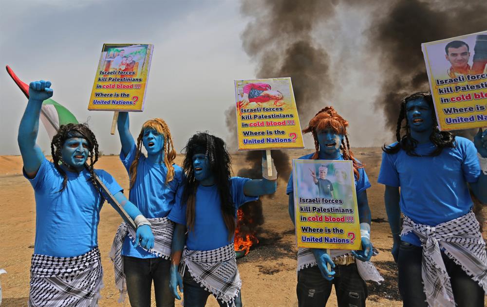 Palestinians dressed as Avatar characters protest near Gaza-Israel border
