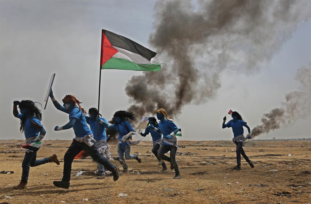 Palestinians dressed as Avatar characters protest near Gaza-Israel border