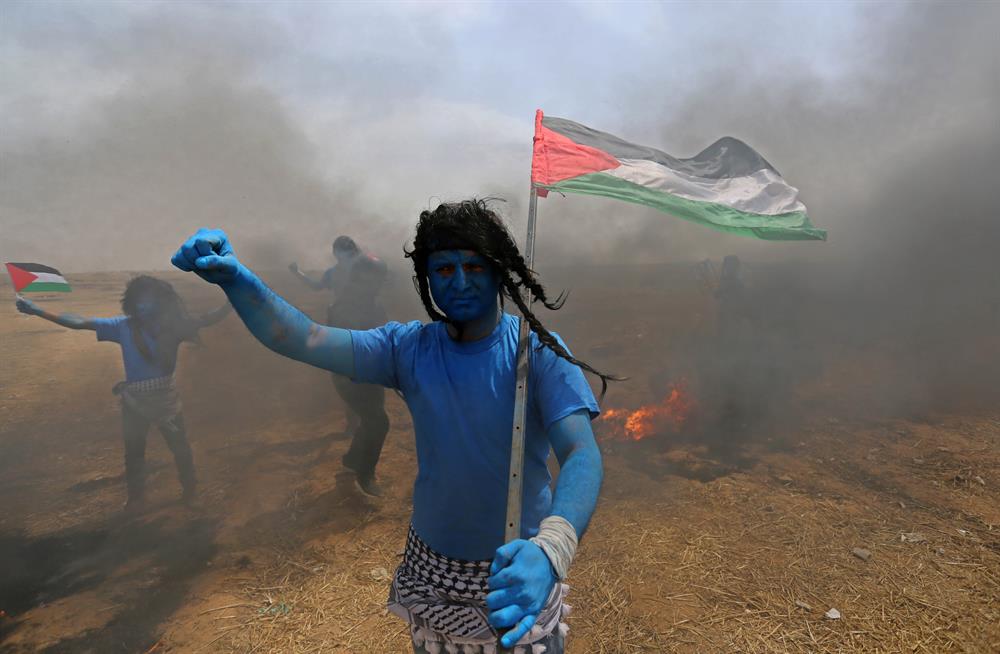 Palestinians dressed as Avatar characters protest near Gaza-Israel border